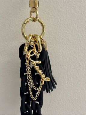 Iconic gold tone CC bag charm, plastic black chain links, 6.5 inches